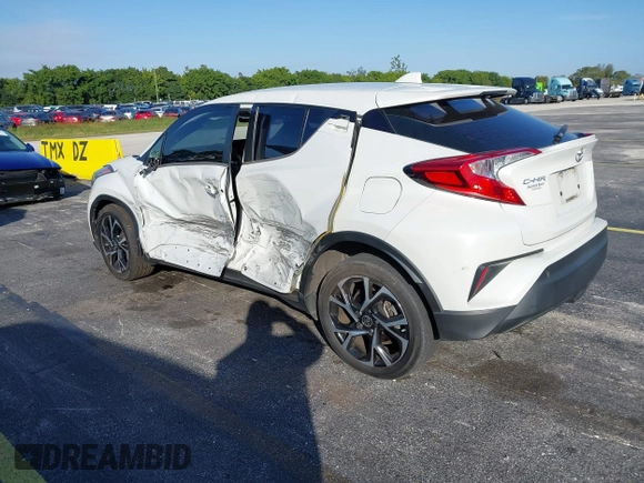 2021 Toyota C-HR LE with VIN NMTKHMBX0MR123981, listed as a IAAI auction lot 41273382 with 51,988 mi miles. Bid and sale history available at carsss.com. Image 3.
