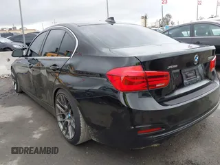2018 BMW 3 Series 330i xDrive with VIN WBA8D9G57JNU67415, listed as a IAAI auction lot 41513343 with 98,714 mi miles. Bid and sale history available at carsss.com. Image 3.
