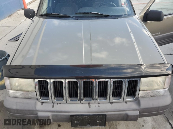 1996 Jeep Grand Cherokee Laredo with VIN 1J4GZ58S3TC245928, listed as a Copart auction lot 57313735 with 165,733 mi miles and Salvage title. Bid and sale history available at DreamBid. Image 12.