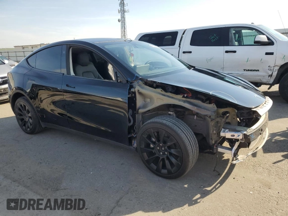 2023 Tesla Model Y Long Range with VIN 7SAYGDEE5PF834645, listed as a Copart auction lot 48596925 with 26,896 mi miles and Salvage Title. Bid and sale history available at DreamBid. Image 4.
