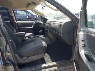 2004 Jeep Grand Cherokee Laredo with VIN 1J4GX48S44C205469, listed as a IAAI auction lot 42310571 with 154,929 mi miles and . Bid and sale history available at DreamBid. Image 5.