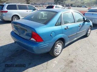 2000 Ford Focus LX with VIN 1FAFP33P8YW330922, listed as a IAAI auction lot 41643279 with 153,400 mi miles and . Bid and sale history available at carsss.com. Image 4.