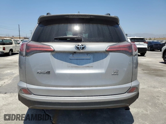 2017 Toyota RAV4 LE with VIN 2T3BFREV6HW658235, listed as a Copart auction lot 63409005 with 62,303 mi miles and Salvage title. Bid and sale history available at DreamBid. Image 6.