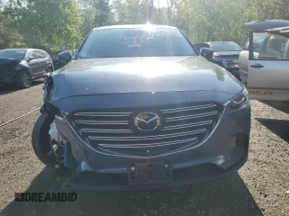 2023 Mazda CX-9 Touring z VIN JM3TCBCYXP0650893, wystawiony jako Copart lot #56875635 z przebiegiem 30 055 mil mil oraz Czysty tytuł • Clean title. Historia ofert i sprzedaży dostępna na DreamBid. Obrazek 5.