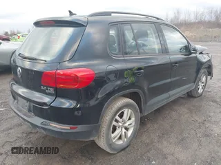 2015 Volkswagen Tiguan SE z VIN WVGBV7AXXFW612903, wystawiony jako IAAI lot #41017461 z przebiegiem 149 297 mil mil oraz . Historia ofert i sprzedaży dostępna na DreamBid. Obrazek 4.