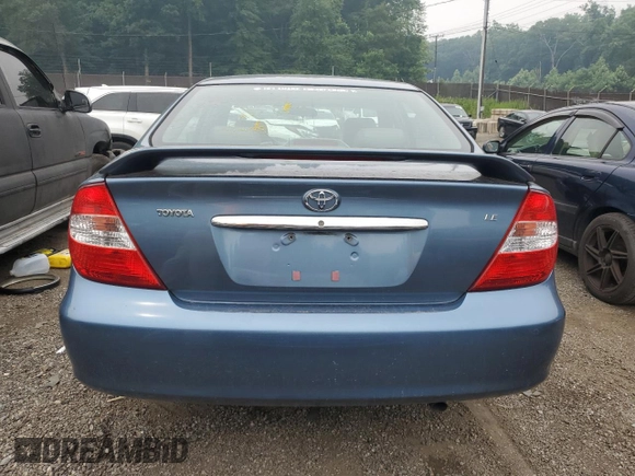 2002 Toyota Camry LE z VIN 4T1BE32K82U635971, wystawiony jako Copart lot #60784855 z przebiegiem Nie podano mil oraz Szkoda całkowita • Salvage title. Historia ofert i sprzedaży dostępna na DreamBid. Obrazek 6.