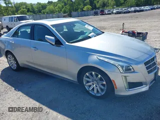 2014 Cadillac CTS Luxury AWD z VIN 1G6AX5S34E0124464, wystawiony jako IAAI lot #42298607 z przebiegiem 89 351 mil mil oraz . Historia ofert i sprzedaży dostępna na DreamBid. Obrazek 1.