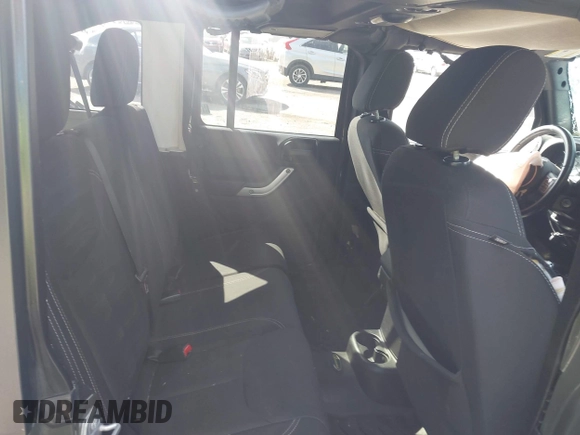 2015 Jeep Wrangler Unlimited Altitude z VIN 1C4HJWEG0FL752152, wystawiony jako IAAI lot #42311043 z przebiegiem 112 379 mil mil oraz . Historia ofert i sprzedaży dostępna na DreamBid. Obrazek 8.