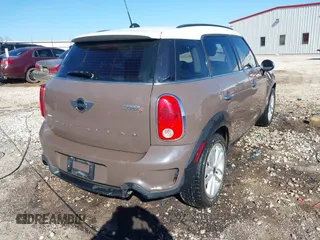 2014 MINI Countryman S with VIN WMWZC3C5XEWP52054, listed as a IAAI auction lot 41452354 with 104,873 mi miles and . Bid and sale history available at DreamBid. Image 4.