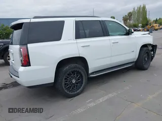 2019 GMC Yukon SLT with VIN 1GKS2BKC3KR160060, listed as a IAAI auction lot 42042122 with 124,733 mi miles. Bid and sale history available at carsss.com. Image 4.