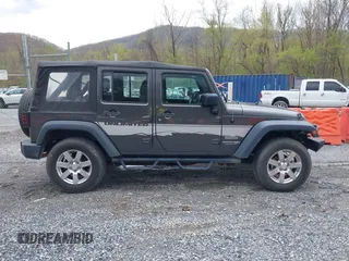 2018 Jeep Wrangler JK Unlimited Sport S with VIN 1C4BJWDG8JL895981, listed as a IAAI auction lot 42048316 with 95,457 mi miles. Bid and sale history available at carsss.com. Image 12.