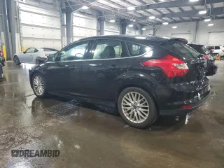 2014 Ford Focus Titanium with VIN 1FADP3N2XEL131392, listed as a Copart auction lot 61665025 with 105,597 mi miles and Salvage title. Bid and sale history available at DreamBid. Image 2.