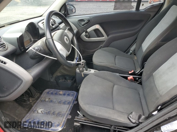 2012 Smart fortwo Pure z VIN WMEEJ3BA2CK571073, wystawiony jako Copart lot #51215135 z przebiegiem 78 686 mil mil oraz Szkoda całkowita • Salvage title. Historia ofert i sprzedaży dostępna na DreamBid. Obrazek 7.