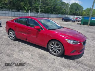 2014 Mazda 6 i Grand Touring with VIN JM1GJ1W69E1133211, listed as a IAAI auction lot 42310673 with 145,598 mi miles and . Bid and sale history available at DreamBid. Image 1.