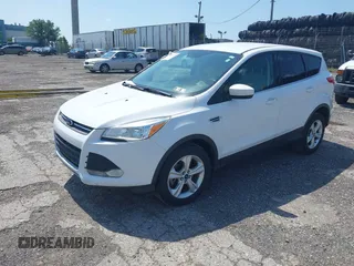 2014 Ford Escape SE with VIN 1FMCU9GX9EUC61521, listed as a IAAI auction lot 42535244 with 129,315 mi miles and . Bid and sale history available at DreamBid. Image 2.
