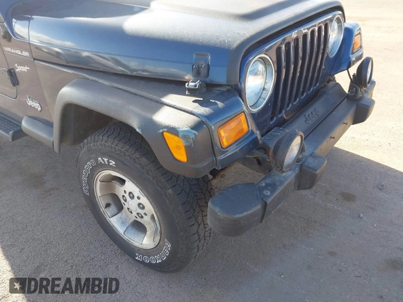 2002 Jeep Wrangler Sport z VIN 1J4FA49SX2P760671, wystawiony jako IAAI lot #41861841 z przebiegiem 125 728 mil mil oraz . Historia ofert i sprzedaży dostępna na DreamBid. Obrazek 6.