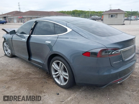 2013 Tesla Model S with VIN 5YJSA1CG9DFP27357, listed as a IAAI auction lot 42362514 with Not provided miles and . Bid and sale history available at DreamBid. Image 3.