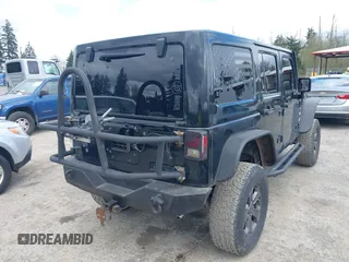2014 Jeep Wrangler Unlimited Sahara with VIN 1C4BJWEG6EL107526, listed as a IAAI auction lot 42030244 with 69,077 mi miles. Bid and sale history available at carsss.com. Image 4.