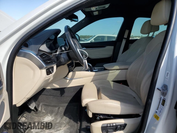 2018 BMW X6 sDrive35i with VIN 5UXKU0C5XJ0G69741, listed as a Copart auction lot 77366934 with 66,287 mi miles and Salvage Title. Bid and sale history available at carsss.com. Image 7.