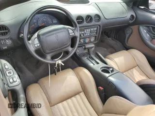2001 Pontiac Firebird Trans Am z VIN 2G2FV32G812134704, wystawiony jako Copart lot #74893594 z przebiegiem Nie podano mil oraz Nie do naprawy • Non repairable. Historia ofert i sprzedaży dostępna na DreamBid. Obrazek 8.