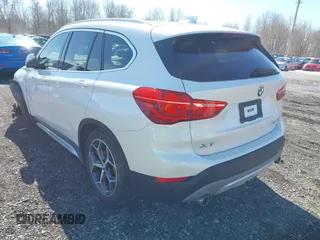 2019 BMW X1 xDrive28i with VIN WBXHT3C58K5N05523, listed as a IAAI auction lot 41752675 with 63,861 mi miles. Bid and sale history available at carsss.com. Image 3.