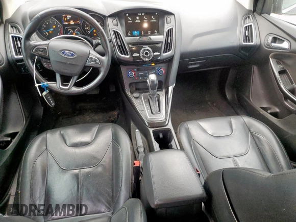 2018 Ford Focus Titanium z VIN 1FADP3N2XJL289659, wystawiony jako Copart lot #65594275 z przebiegiem 115 739 mil mil oraz Czysty tytuł • Clean title. Historia ofert i sprzedaży dostępna na DreamBid. Obrazek 8.