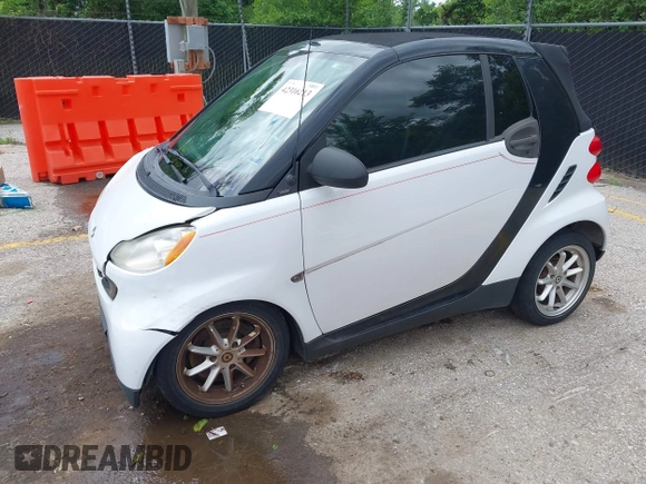 2009 Smart fortwo Passion z VIN WMEEK31X79K210918, wystawiony jako IAAI lot #42316213 z przebiegiem 99 667 mil mil oraz . Historia ofert i sprzedaży dostępna na DreamBid. Obrazek 2.