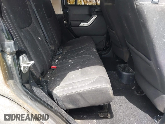 2016 Jeep Wrangler Unlimited Sahara z VIN 1C4HJWEG4GL261147, wystawiony jako IAAI lot #42239252 z przebiegiem 69 604 mil mil oraz . Historia ofert i sprzedaży dostępna na DreamBid. Obrazek 8.