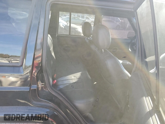 2001 Jeep Cherokee Sport z VIN 1J4FF58S61L612533, wystawiony jako Copart lot #76824714 z przebiegiem 62 401 mil mil oraz Szkoda całkowita • Salvage title. Historia ofert i sprzedaży dostępna na DreamBid. Obrazek 10.
