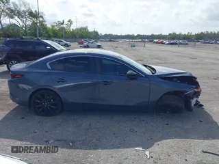 2024 Mazda 3 S Carbon Edition with VIN 3MZBPBCM2RM403824, listed as a IAAI auction lot 42612315 with 8,261 mi miles and . Bid and sale history available at DreamBid. Image 14.