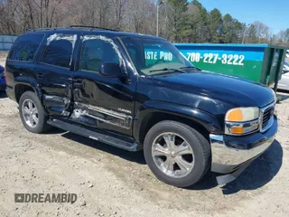 2002 GMC Yukon SLT with VIN 1GKEK13Z52J245331, listed as a IAAI auction lot 41832510 with 215,225 mi miles. Bid and sale history available at carsss.com. Image 1.