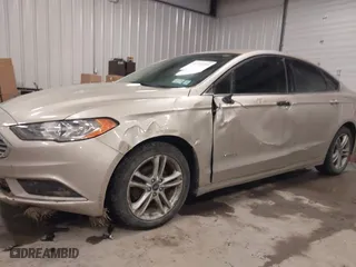2018 Ford Fusion Hybrid S with VIN 3FA6P0UU5JR100377, listed as a IAAI auction lot 41300284 with 108,936 mi miles. Bid and sale history available at carsss.com. Image 6.