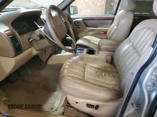 1999 Jeep Grand Cherokee Limited with VIN 1J4GW68N3XC799663, listed as a Copart auction lot 45630695 with 149,125 mi miles and Salvage Title. Bid and sale history available at carsss.com. Image 7.