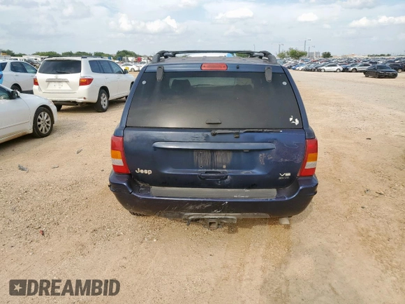2004 Jeep Grand Cherokee with VIN 1J8GX58J54C121513, listed as a Copart auction lot 59384005 with 221,397 mi miles and Salvage title. Bid and sale history available at DreamBid. Image 6.