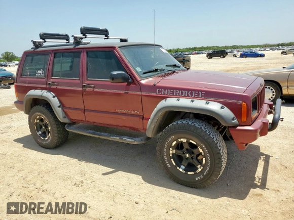 1999 Jeep Cherokee Sport с VIN 1J4FT68S5XL675839, выставлен на аукционе Copart как лот 65230005 с пробегом 204 102 миль миль и Списание • Salvage title. История ставок и продаж доступна на DreamBid. Изображение 4.