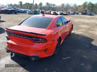 2023 Dodge Charger Scat Pack Widebody with VIN 2C3CDXGJ4PH670928, listed as a IAAI auction lot 41492124 with 64 mi miles and . Bid and sale history available at DreamBid. Image 4.