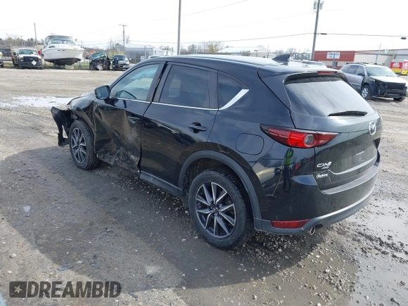 2018 Mazda CX-5 Touring with VIN JM3KFBCMXJ0438177, listed as a IAAI auction lot 42152275 with 65,434 mi miles and . Bid and sale history available at carsss.com. Image 3.