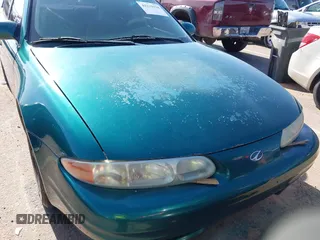 1999 Oldsmobile Alero GL z VIN 1G3NL52T0XC354966, wystawiony jako IAAI lot #42259258 z przebiegiem Nie podano mil oraz . Historia ofert i sprzedaży dostępna na DreamBid. Obrazek 12.