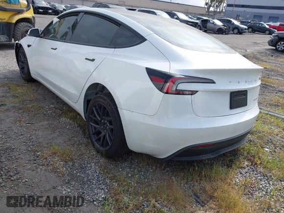 2024 Tesla Model 3 Long Range with VIN 5YJ3E1EB7RF854092, listed as a IAAI auction lot 41697646 with 7,371 mi miles and . Bid and sale history available at DreamBid. Image 3.