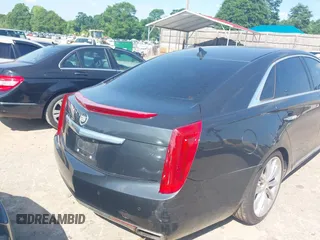 2013 Cadillac XTS Luxury z VIN 2G61P5S37D9110658, wystawiony jako IAAI lot #42196442 z przebiegiem 182 228 mil mil oraz . Historia ofert i sprzedaży dostępna na DreamBid. Obrazek 4.