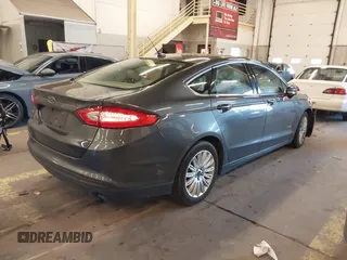 2016 Ford Fusion SE Hybrid with VIN 3FA6P0LU9GR235291, listed as a IAAI auction lot 41560312 with 112,777 mi miles. Bid and sale history available at carsss.com. Image 4.