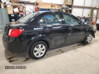 2010 Kia Rio with VIN KNADH4B37A6641845, listed as a Copart auction lot 51861215 with 163,894 mi miles and Salvage Title. Bid and sale history available at DreamBid. Image 3.