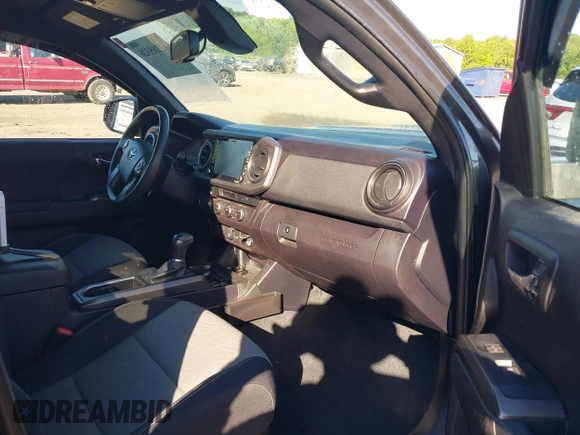 2021 Toyota Tacoma SR z VIN 3TYCZ5AN7MT017377, wystawiony jako IAAI lot #42285326 z przebiegiem 91 657 mil mil oraz . Historia ofert i sprzedaży dostępna na DreamBid. Obrazek 5.