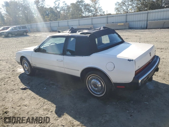 1987 Oldsmobile Toronado with VIN 1G3EZ1130HU307201, listed as a Copart auction lot 78028584 with 104,837 mi miles and Salvage Title. Bid and sale history available at DreamBid. Image 2.
