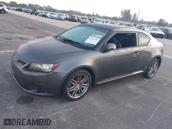 2012 Scion tC with VIN JTKJF5C74C3026945, listed as a IAAI auction lot 41757437 with 104,039 mi miles. Bid and sale history available at carsss.com. Image 2.