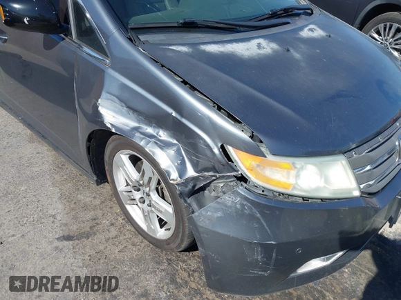 2011 Honda Odyssey Touring with VIN 5FNRL5H96BB009580, listed as a IAAI auction lot 42202595 with Not provided miles and . Bid and sale history available at DreamBid. Image 6.