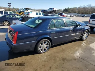 2006 Cadillac DTS 1SB z VIN 1G6KD57Y56U220535, wystawiony jako Copart lot #89196185 z przebiegiem 94 312 mil mil oraz Szkody całkowita. Historia ofert i sprzedaży dostępna na DreamBid. Obrazek 3.