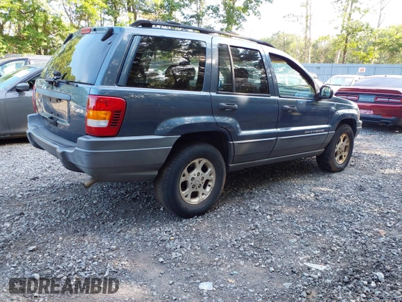 2001 Jeep Grand Cherokee Laredo with VIN 1J4GW48SX1C585867, listed as a IAAI auction lot 42793657 with 197,167 mi miles and . Bid and sale history available at DreamBid. Image 4.