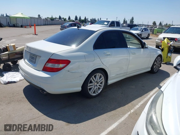 2009 Mercedes-Benz C-Class 3.0L Sport with VIN WDDGF54X09F233877, listed as a IAAI auction lot 42121123 with 215,698 mi miles. Bid and sale history available at carsss.com. Image 4.