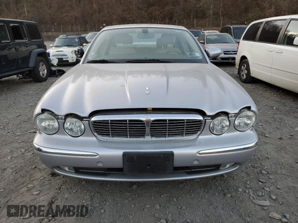 2005 Jaguar XJ with VIN SAJWA79C55SG37981, listed as a Copart auction lot 81142484 with 128,601 mi miles and Salvage Title. Bid and sale history available at carsss.com. Image 5.